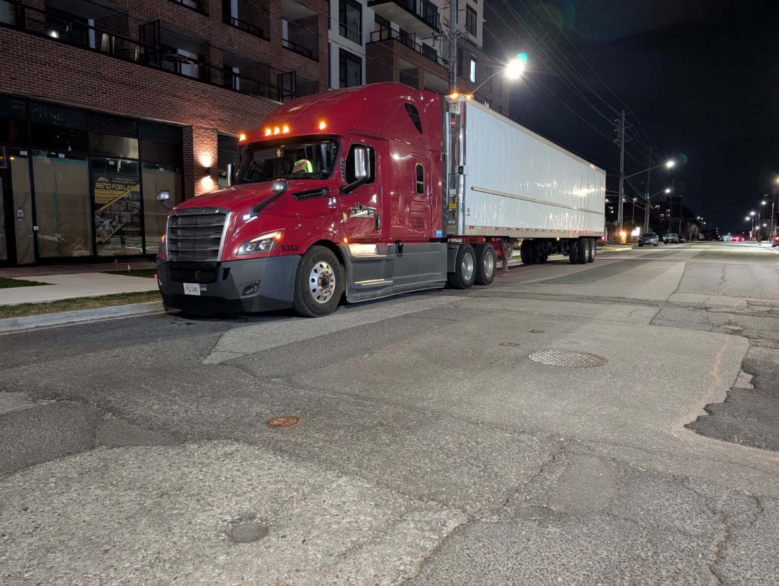 WGD Expedite tractor on urban street at night