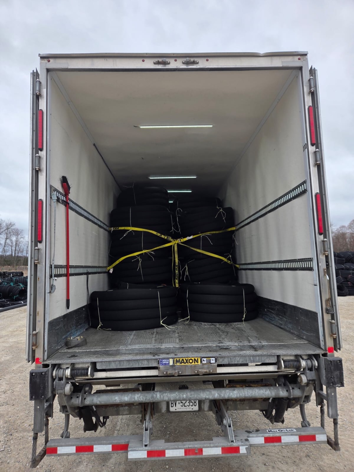 Strapped cargo secured on trailer floor